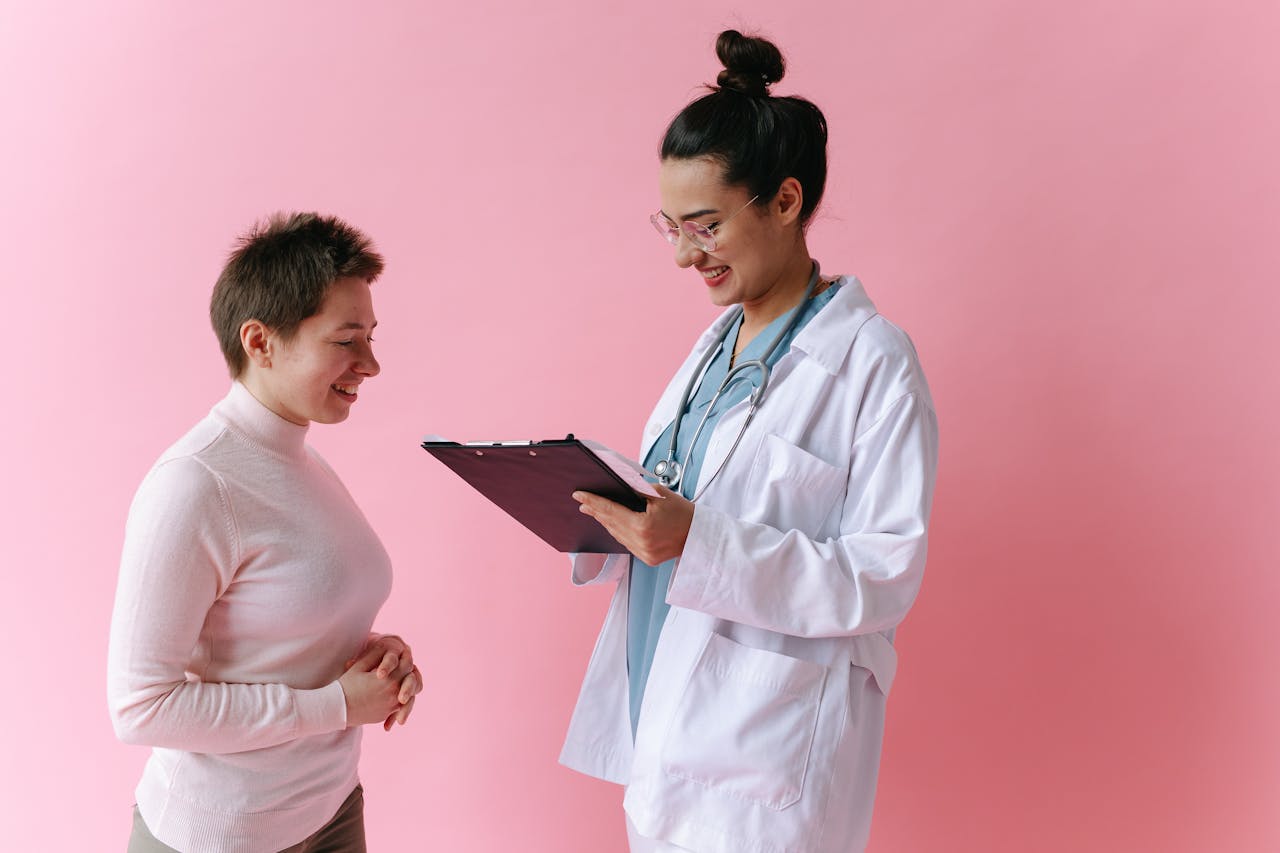 Doctor reviewing health charts during patient wellness visit at Thrive primary care clinic